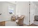 Bright sitting area features neutral paint, hardwood floors, and large window views at 6838 Prelude Dr, Atlanta, GA 30328