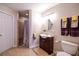 Bathroom featuring a vanity, tile flooring, toilet, and a tiled walk-in shower with seating at 855 Hood Rd, Fayetteville, GA 30214