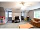 Finished bonus room with plush carpet, windows, and open layout offering various uses and furniture configurations at 855 Hood Rd, Fayetteville, GA 30214