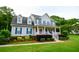 Attractive two-story home with blue shutters, a covered front porch, and manicured lawn at 855 Hood Rd, Fayetteville, GA 30214