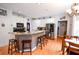 Bright kitchen with stainless steel appliances, a large island, and hardwood floors at 855 Hood Rd, Fayetteville, GA 30214