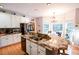 Spacious kitchen with granite countertops, stainless steel appliances, and a breakfast bar at 855 Hood Rd, Fayetteville, GA 30214