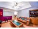 Spacious lower level featuring a seating area, wet bar, built-in shelving, and staircase at 855 Hood Rd, Fayetteville, GA 30214