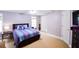 Sunny main bedroom features a neutral color scheme and carpet at 855 Hood Rd, Fayetteville, GA 30214