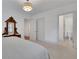 Bright bedroom with ensuite bathroom featuring neutral walls and carpet, with a peek into the bathroom at 2620 Middle Coray Cir, Marietta, GA 30066