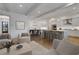 Bright, open-concept living and dining area featuring hardwood floors and modern furnishings at 2620 Middle Coray Cir, Marietta, GA 30066