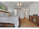 This main bedroom features hardwood floors, neutral walls, light window coverings, and an ensuite bathroom at 2620 Middle Coray Cir, Marietta, GA 30066