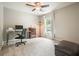 Bedroom featuring carpeted floors, a ceiling fan, a desk, and a window for natural light at 411 Mountain View Ln, Woodstock, GA 30188