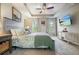The main bedroom features a tray ceiling, carpeted floor, and ample windows for natural light at 411 Mountain View Ln, Woodstock, GA 30188