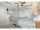 Main bedroom boasting tray ceiling, carpet, ceiling fan, and mounted tv at 411 Mountain View Ln, Woodstock, GA 30188