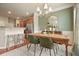 Elegant dining room with hardwood floors and modern decor at 411 Mountain View Ln, Woodstock, GA 30188