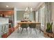 Charming dining room with chandelier, rug, and stylish decor at 411 Mountain View Ln, Woodstock, GA 30188