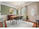 Cozy dining area with a classic chandelier and wainscoting at 411 Mountain View Ln, Woodstock, GA 30188