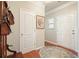 Inviting foyer with hardwood floors, closet, and decorative accents at 411 Mountain View Ln, Woodstock, GA 30188