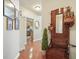 Hallway with hardwood floors, hall tree, and view of the kitchen at 411 Mountain View Ln, Woodstock, GA 30188