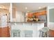 Kitchen with granite counters, breakfast bar, and stainless appliances at 411 Mountain View Ln, Woodstock, GA 30188