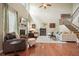 Inviting living room with high ceilings, hardwood floors, and staircase access at 411 Mountain View Ln, Woodstock, GA 30188