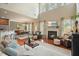Inviting living room with fireplace, open floor plan, and lots of natural light at 411 Mountain View Ln, Woodstock, GA 30188