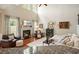 Cozy living room with a fireplace, plush seating, and hardwood flooring at 411 Mountain View Ln, Woodstock, GA 30188