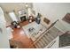 Bright living room with wood floors, fireplace, and comfortable seating arrangement at 411 Mountain View Ln, Woodstock, GA 30188