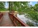 Quaint wooden bridge over the tranquil pond, offering scenic views and a peaceful crossing at 411 Mountain View Ln, Woodstock, GA 30188