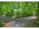 Scenic view of gravel walking trails winding through a lush green forest at 411 Mountain View Ln, Woodstock, GA 30188