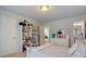 Bedroom with built in shelves and an adjoining door to bathroom at 5915 Partners Pass, Cumming, GA 30028