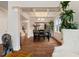 Elegant dining room with coffered ceiling, decorative lighting, hardwood floors, and upscale decor at 5915 Partners Pass, Cumming, GA 30028