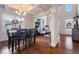 Dining room with coffered ceiling, large windows and hardwood floors at 5915 Partners Pass, Cumming, GA 30028