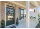 Inviting front porch with decorative wreath, well-kept landscaping, and classic architectural details at 5915 Partners Pass, Cumming, GA 30028