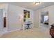 Hallway with a piano and an open doorway leading to a bedroom at 5915 Partners Pass, Cumming, GA 30028