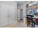 Bright hobby room with dual closets and a built-in desk with shelving at 5915 Partners Pass, Cumming, GA 30028