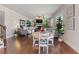 Bright open space features hardwood floors and an open dining area adjoining the living area with fireplace at 5915 Partners Pass, Cumming, GA 30028