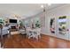 The open floor plan showcases a dining area and living room that leads to an outdoor living space at 5915 Partners Pass, Cumming, GA 30028