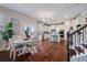 Spacious interior with hardwood floors seamlessly connects dining area and kitchen at 5915 Partners Pass, Cumming, GA 30028