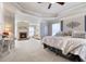 This main bedroom features a fireplace, sitting area, and decorative wall at 5915 Partners Pass, Cumming, GA 30028