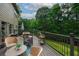 Inviting back deck with wooded views provides serene outdoor living and entertaining space at 7880 Brands Hatch Blvd, Cumming, GA 30040