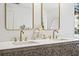 Bathroom featuring double vanity with vessel sinks and marble countertops at 7880 Brands Hatch Blvd, Cumming, GA 30040