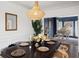 Formal dining room with grand piano in the background, adding a touch of elegance at 7880 Brands Hatch Blvd, Cumming, GA 30040