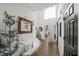 Bright foyer with hardwood floors, stylish decor, and open staircase leading to the upper level at 7880 Brands Hatch Blvd, Cumming, GA 30040