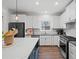 Modern kitchen showcases white cabinets, sleek countertops, and stainless steel appliances at 7880 Brands Hatch Blvd, Cumming, GA 30040