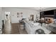 Spacious living room with a fireplace, built-in shelving, and an open floor plan at 7880 Brands Hatch Blvd, Cumming, GA 30040