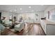 Open living room with hardwood floors and ample natural light at 7880 Brands Hatch Blvd, Cumming, GA 30040