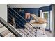 Elegant living room featuring a white piano, navy blue walls, and large windows at 7880 Brands Hatch Blvd, Cumming, GA 30040