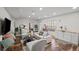 Cozy living room featuring hardwood floors and stylish furnishings at 7880 Brands Hatch Blvd, Cumming, GA 30040