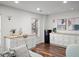 Bright living area features a sink, mini-fridge, modern cabinets, and stylish decor at 7880 Brands Hatch Blvd, Cumming, GA 30040