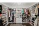 Spacious walk-in closet with custom shelving and hanging racks at 7880 Brands Hatch Blvd, Cumming, GA 30040