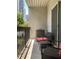 Cozy outdoor balcony with wrought-iron furniture at 1075 Peachtree Walk # A205, Atlanta, GA 30309