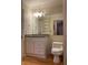 Bright bathroom featuring a granite vanity and toilet at 1075 Peachtree Walk # A205, Atlanta, GA 30309