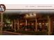 Charming cafe with a welcoming outdoor seating area adorned with decorative lights at 1075 Peachtree Walk # A205, Atlanta, GA 30309